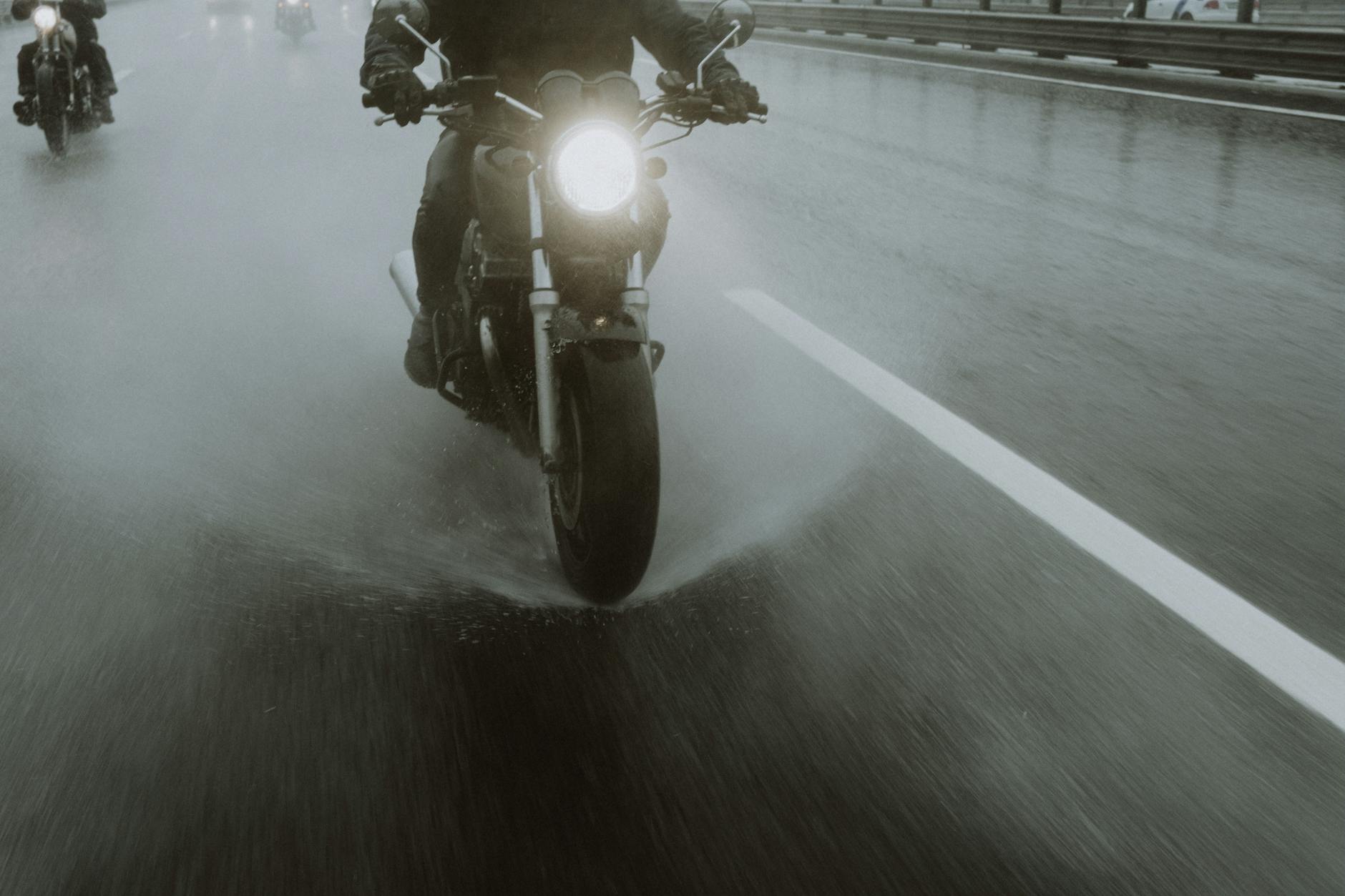 a person riding a motorcycle on the road